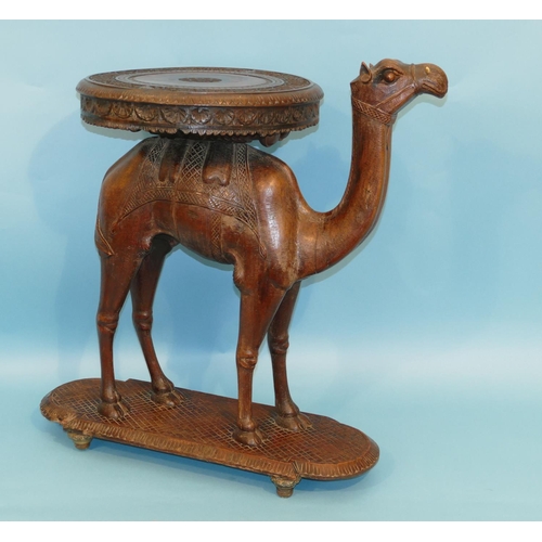 622 - A 19th Century Anglo Indian Carved Table in form of a camel with octagonal top, on oblong D-end base... 