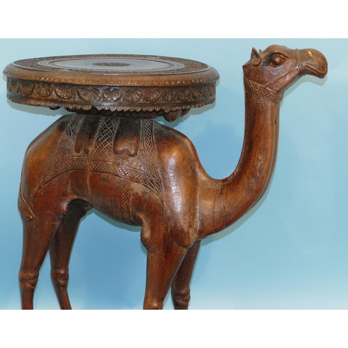 622 - A 19th Century Anglo Indian Carved Table in form of a camel with octagonal top, on oblong D-end base... 