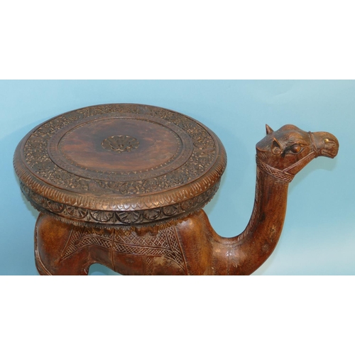 622 - A 19th Century Anglo Indian Carved Table in form of a camel with octagonal top, on oblong D-end base... 