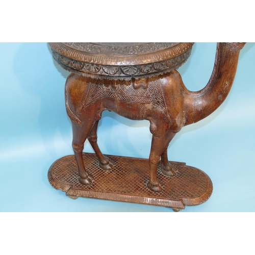 622 - A 19th Century Anglo Indian Carved Table in form of a camel with octagonal top, on oblong D-end base... 