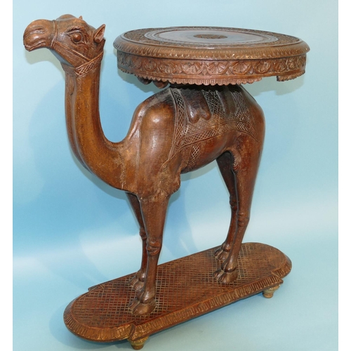 622 - A 19th Century Anglo Indian Carved Table in form of a camel with octagonal top, on oblong D-end base... 