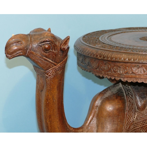 622 - A 19th Century Anglo Indian Carved Table in form of a camel with octagonal top, on oblong D-end base... 