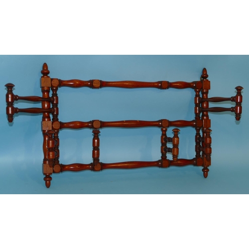 628 - A Victorian Mahogany Hanging Coat Rack having turned supports and finials, 68cm wide closed x 45cm h... 