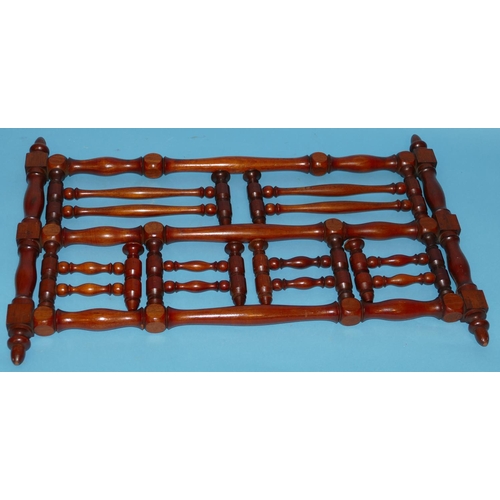 628 - A Victorian Mahogany Hanging Coat Rack having turned supports and finials, 68cm wide closed x 45cm h... 