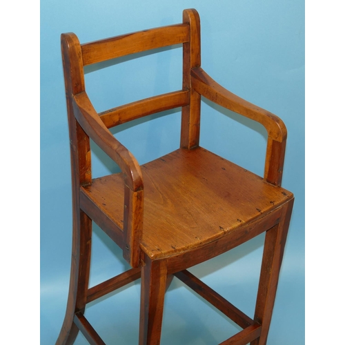 629 - A 19th Century Elm Child's Highchair having solid seat on square tapering legs, 85cm high