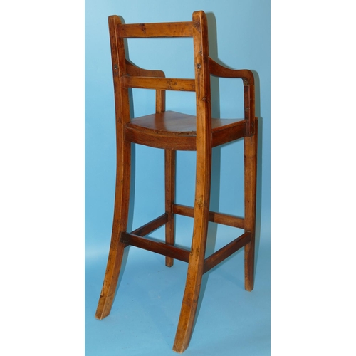 629 - A 19th Century Elm Child's Highchair having solid seat on square tapering legs, 85cm high