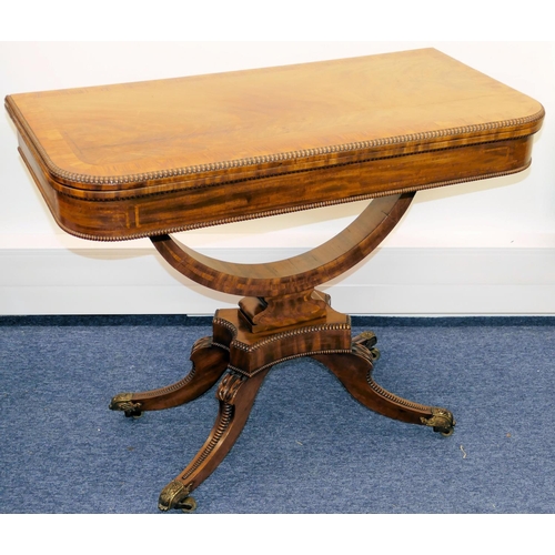 633 - A 19th Century Mahogany Card Table having banded decoration, swivel hinged top (top cracked) on arch... 