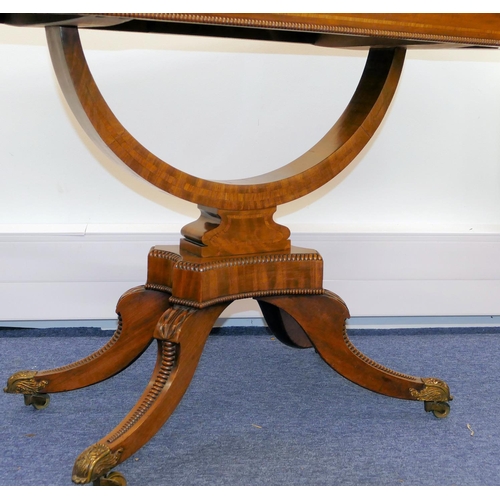 633 - A 19th Century Mahogany Card Table having banded decoration, swivel hinged top (top cracked) on arch... 