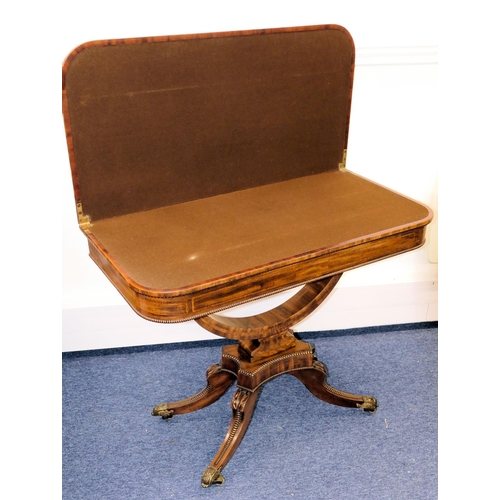 633 - A 19th Century Mahogany Card Table having banded decoration, swivel hinged top (top cracked) on arch... 