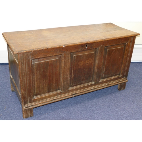 635 - An 18th Century Oak Dower Chest having triple panelled front, hinged lid, enclosing candle box, on s... 