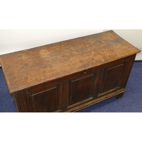 635 - An 18th Century Oak Dower Chest having triple panelled front, hinged lid, enclosing candle box, on s... 