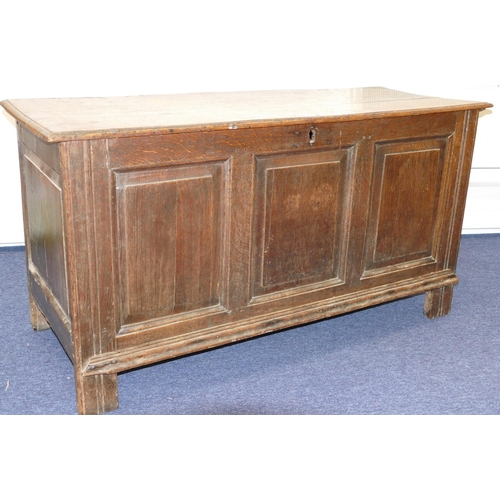 635 - An 18th Century Oak Dower Chest having triple panelled front, hinged lid, enclosing candle box, on s... 