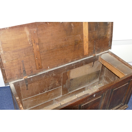 635 - An 18th Century Oak Dower Chest having triple panelled front, hinged lid, enclosing candle box, on s... 