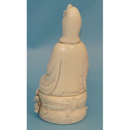 68 - An Oriental Blanc-de-Chine Figure of a seated Goddess holding a vase, 26.5cm high