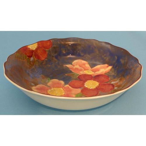 7 - A Royal Doulton Round Bowl having crinkled rim on blue ground with multicoloured floral and leaf dec... 