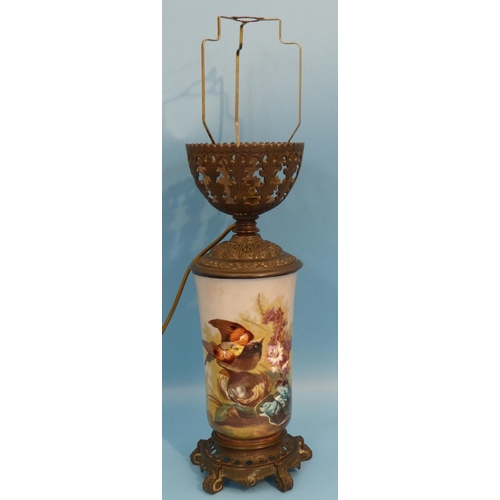 8 - A China and Brass Paraffin Lamp (converted to electricity) having china body with hand painted bird ... 