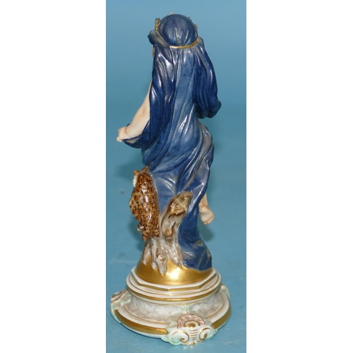 118 - A Meissen Figure of a young cupid draped in a blue cloth with crown standing next to an owl, on glob... 