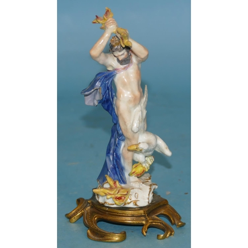 119 - An 18th Century Meissen Figure of a God, wearing a crown standing upon a white bird, draped in a blu... 