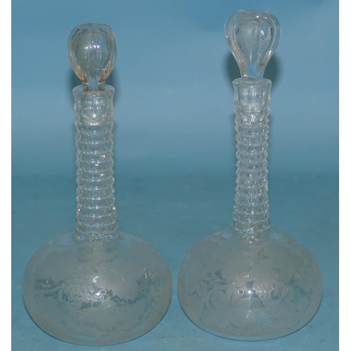 124 - A Pair of Cut Glass Small Round Bulbous Ringed Necked Decanters with stoppers, having all over chase... 