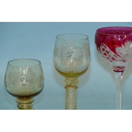 125 - 3 Various Coloured Hock Glasses on star cut bases, also 2 green drinking glasses having engraved gra... 