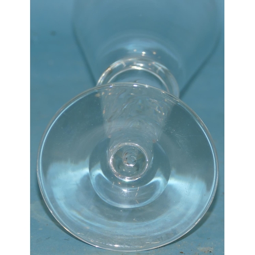 126 - A Trumpet Shaped Ale Glass having inner twist stem on round base, 28cm high.