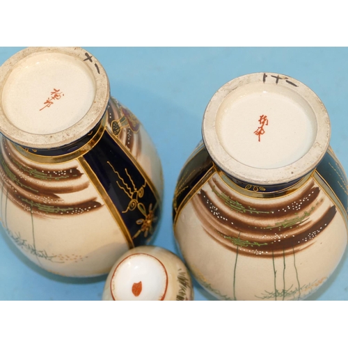 139 - A Pair of Oriental Round Bulbous Thin Necked Vases on blue and cream ground with multicoloured warri... 