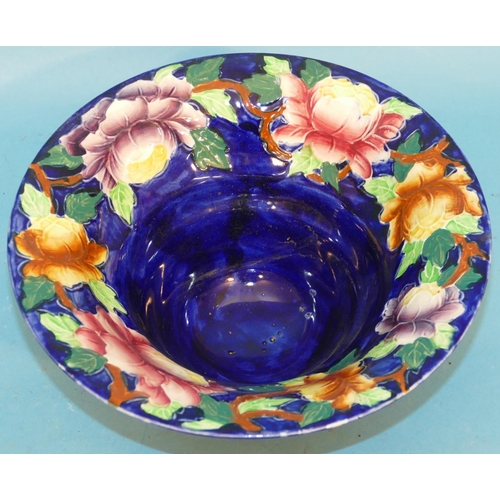 14 - A Maling Round Trumpet Shaped Bowl on Blue Ground with multicoloured floral, leaf decoration, 23.5cm... 