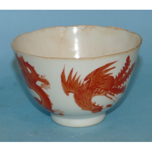 156 - An Oriental Small Round Bowl on white ground having red dragon and phoenix decoration 6.5cm high, 10... 