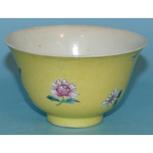 158 - An Oriental Round Trumpet Shaped Tea Bowl on yellow ground having multicoloured floral and leaf deco... 