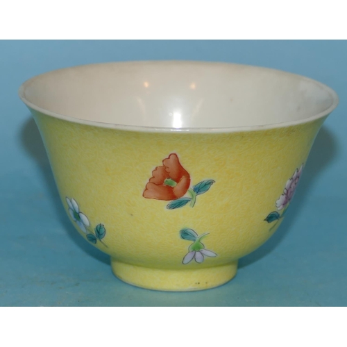 158 - An Oriental Round Trumpet Shaped Tea Bowl on yellow ground having multicoloured floral and leaf deco... 