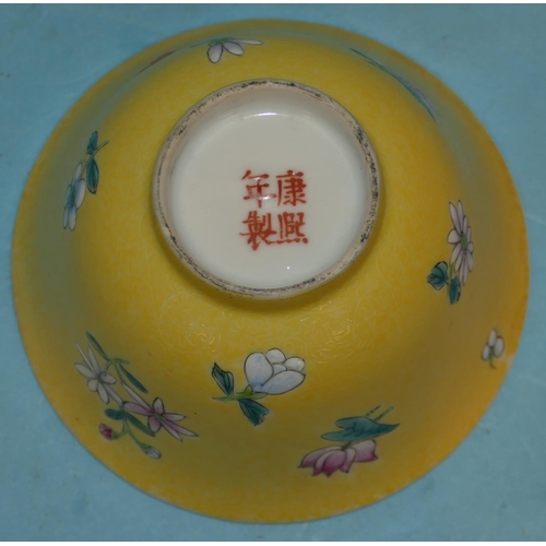 158 - An Oriental Round Trumpet Shaped Tea Bowl on yellow ground having multicoloured floral and leaf deco... 