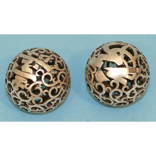 227 - A Pair of Oriental Pierced Balls, 4.5cm diameter.