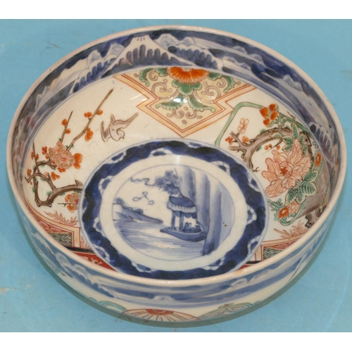 3 - An Imari Small Round Bowl on white and blue ground with multicoloured bird branch, floral and scroll... 