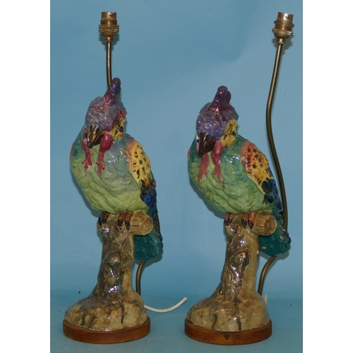 51 - A Pair of Majolica Table Lamps inform of perched parrots on multicoloured ground 50cm high over all.