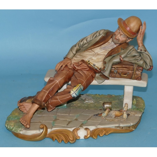 A Capo Di Monte China Figure of a drunken gentleman sprawled on a bench ...