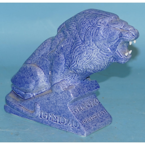 86 - An Ashtead Pottery Genozo Toothpaste Advertising Lion on blue ground 18cm high.