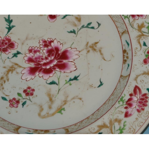 114 - An 18 Century Chinese Charger on white ground having red, green and gilt, floral and leaf decoration... 