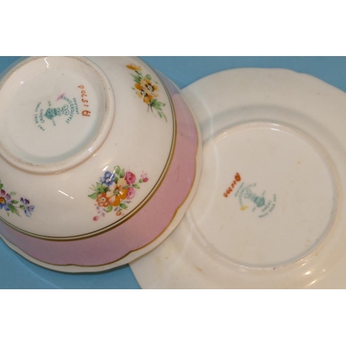 123 - A Crown Staffordshire Tea Service on white and pink ground with multicoloured floral, leaf and gilt ... 