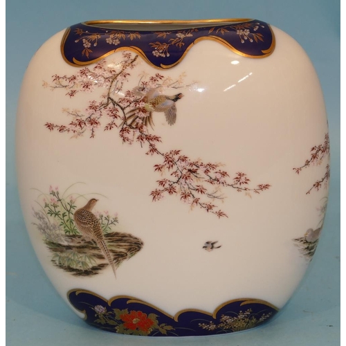 153 - A Japanese Oval Bulbous Shaped Vase on white and blue ground with multicoloured peacock, floral, lea... 