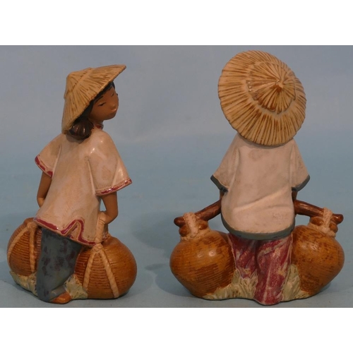 26 - A Pair of Lladro Glazed Earthenware Figures of oriental girl and boy carrying pots, 18cm high.