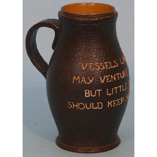 29 - A Doulton and Lambeth Glazed Stoneware Tankard in form of leather with verse having silver rim (chip... 