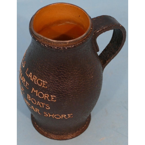 29 - A Doulton and Lambeth Glazed Stoneware Tankard in form of leather with verse having silver rim (chip... 