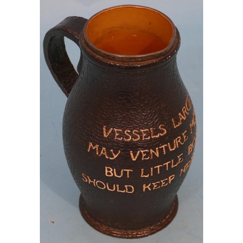 29 - A Doulton and Lambeth Glazed Stoneware Tankard in form of leather with verse having silver rim (chip... 