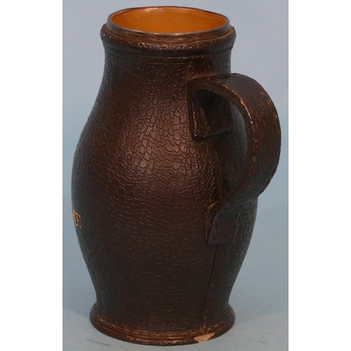 29 - A Doulton and Lambeth Glazed Stoneware Tankard in form of leather with verse having silver rim (chip... 