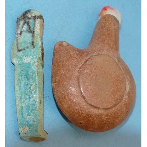 45 - An Egyptian Small Blue China Figure of a mummy, 9cm high, also a terracotta oil lamp (2).