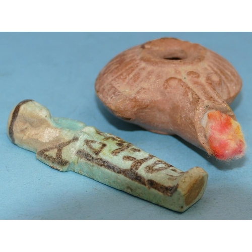 45 - An Egyptian Small Blue China Figure of a mummy, 9cm high, also a terracotta oil lamp (2).