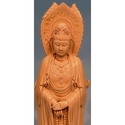 49 - An Oriental Blanc de Chine Group of 3 standing goddesses on circular base, 47cm high.