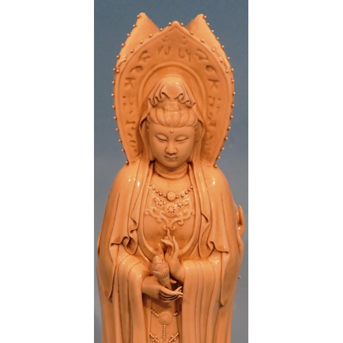 49 - An Oriental Blanc de Chine Group of 3 standing goddesses on circular base, 47cm high.