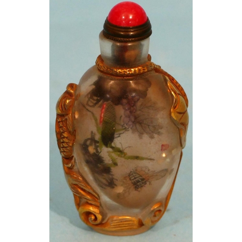 51 - An Oriental Peking Style Glass Snuff Bottle having inner painted insect decoration with stopper, 8cm... 