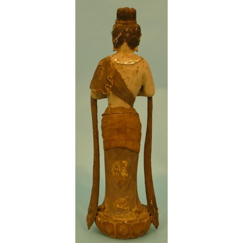 603 - A Carved Oriental Figure of a standing lady on lotus leaf, 36cm high.